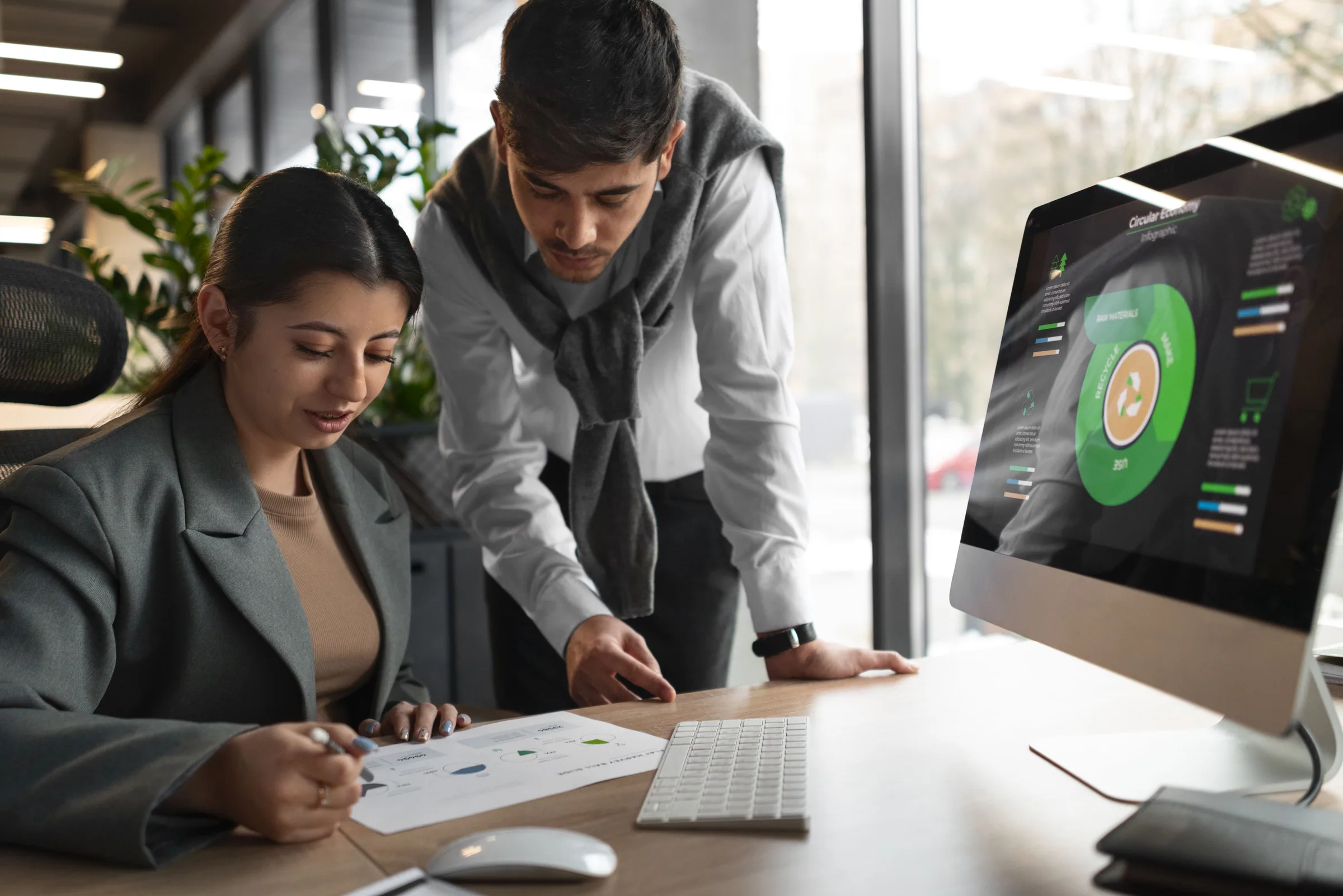 Team collaboration on data-driven business strategy using digital performance dashboards.