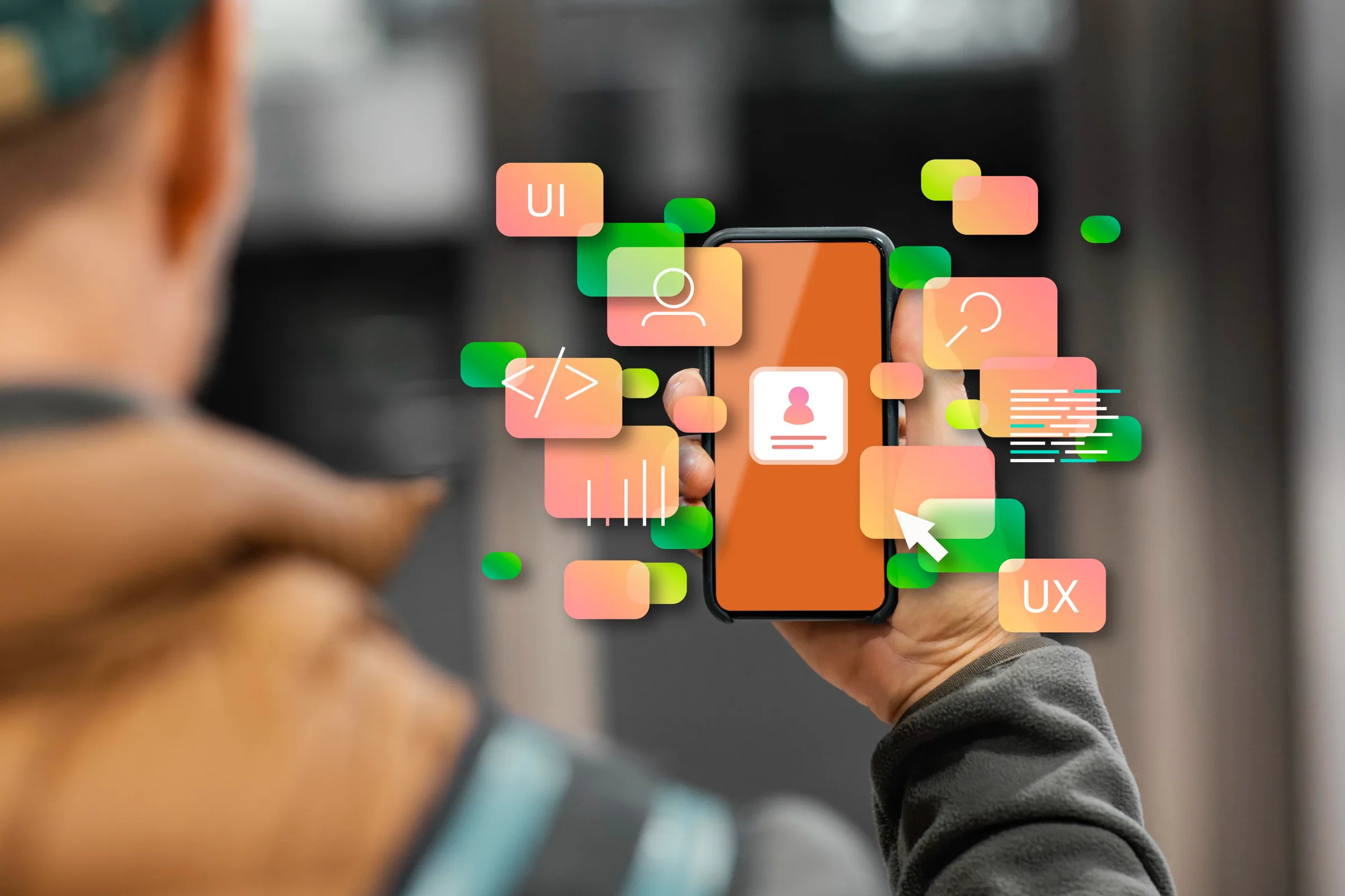 Person holding smartphone with UI and UX design elements representing mobile app user experience strategy.